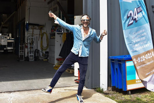 Al Vigneau held up one of his perfect ice "spheres" outside the Hamptons Ice factory and warehouse in Southampton.